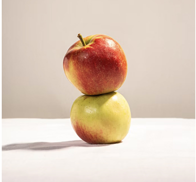 Two apples side by side, illustrating that produce of the same type can differ in nutrient density